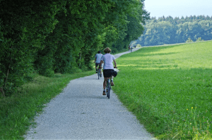 bike-riding-along-path-greenery-outdoors