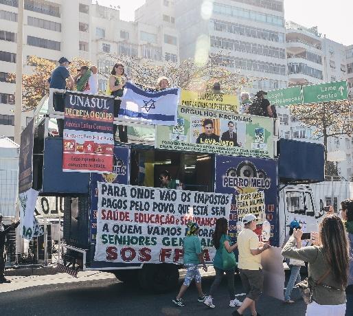 truck in parade with people on it in Brazil