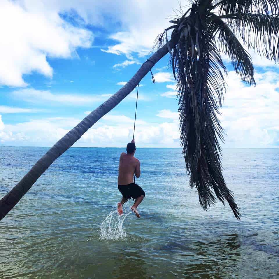 Me trying to swing from a tree in Belize... Luckily the picture was taken during the half second I was above the water