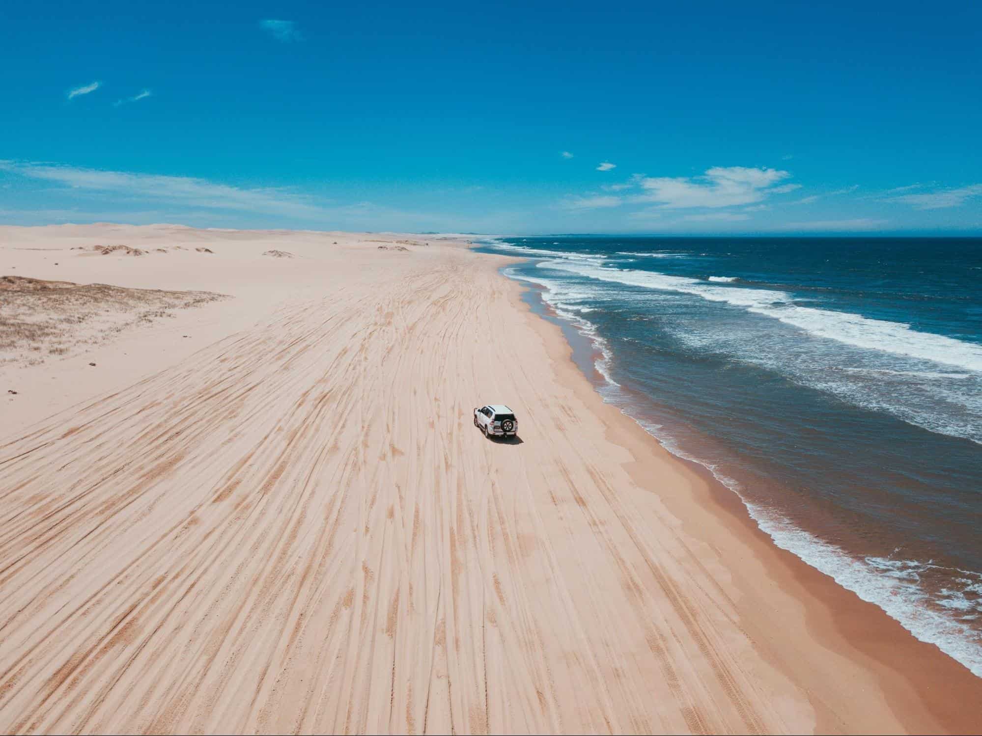 SUV driving on the beach