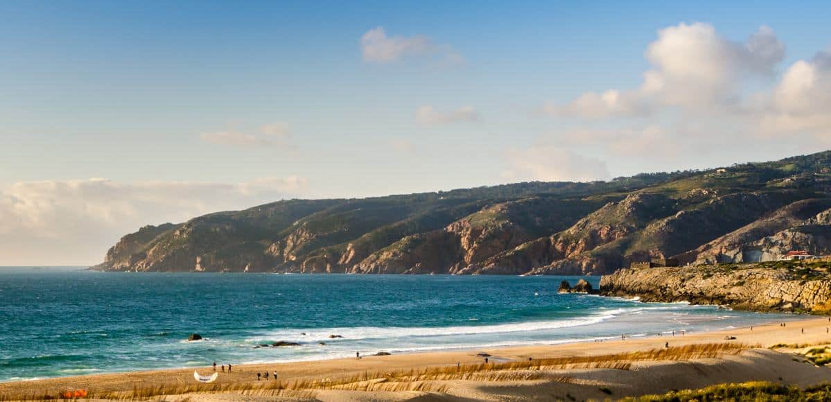 Guincho Beach with Cabo da Roca in background - westernmost point in continental Europe