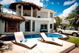 House with pool and lounge chairs