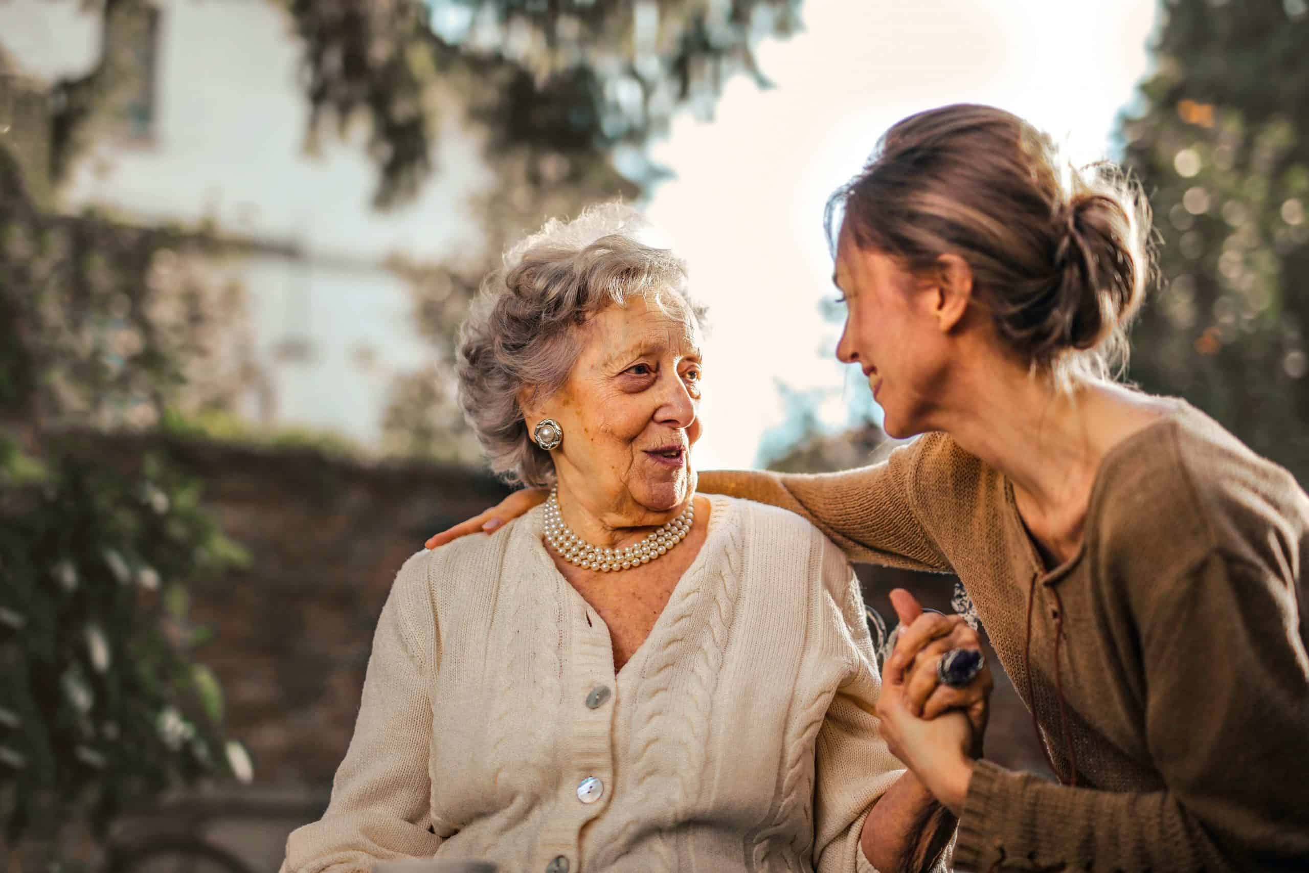 elderly woman and daughter having a conversation