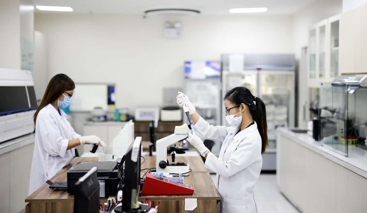 two scientist doing medical procedures