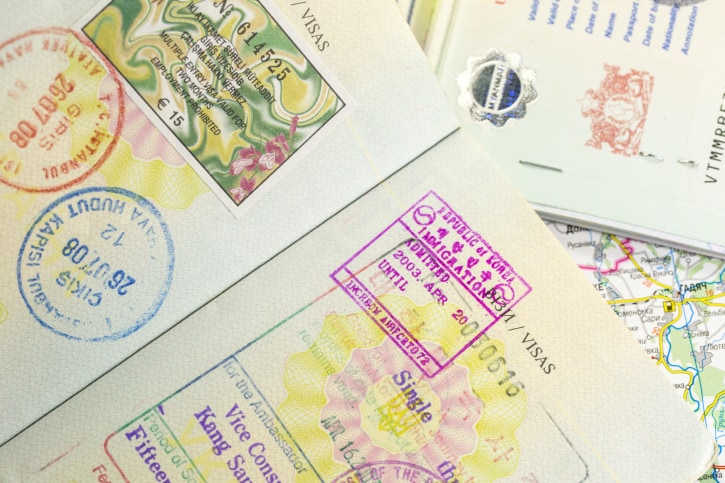 passports with several stamps on them