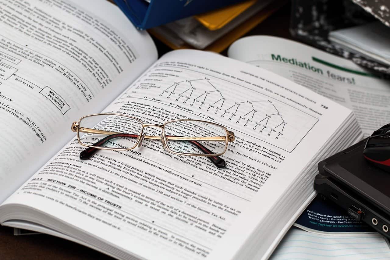 glasses on top of a tax book