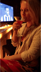 Gabby drinking a martini at the hotel cigar bar on our first night