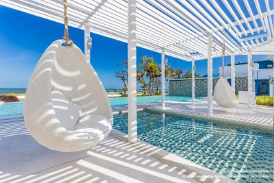 swing chair by pool at condo in Thailand