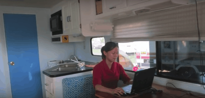 Cheng working from inside her RV