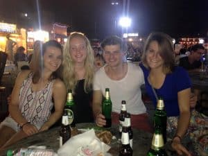 Friends in Thailand drinking beer