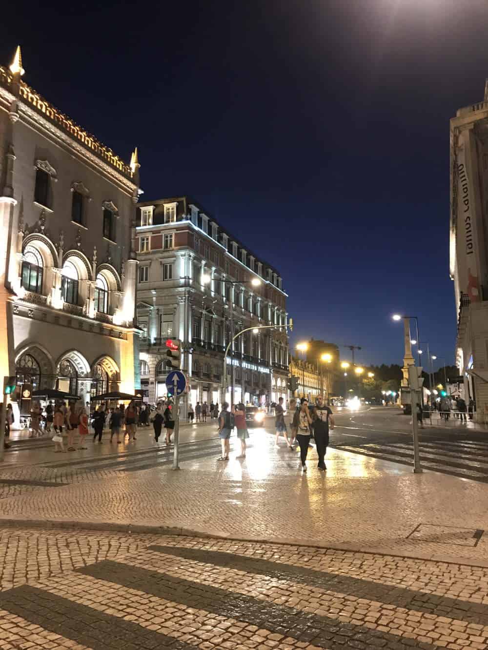people walking on the street at night