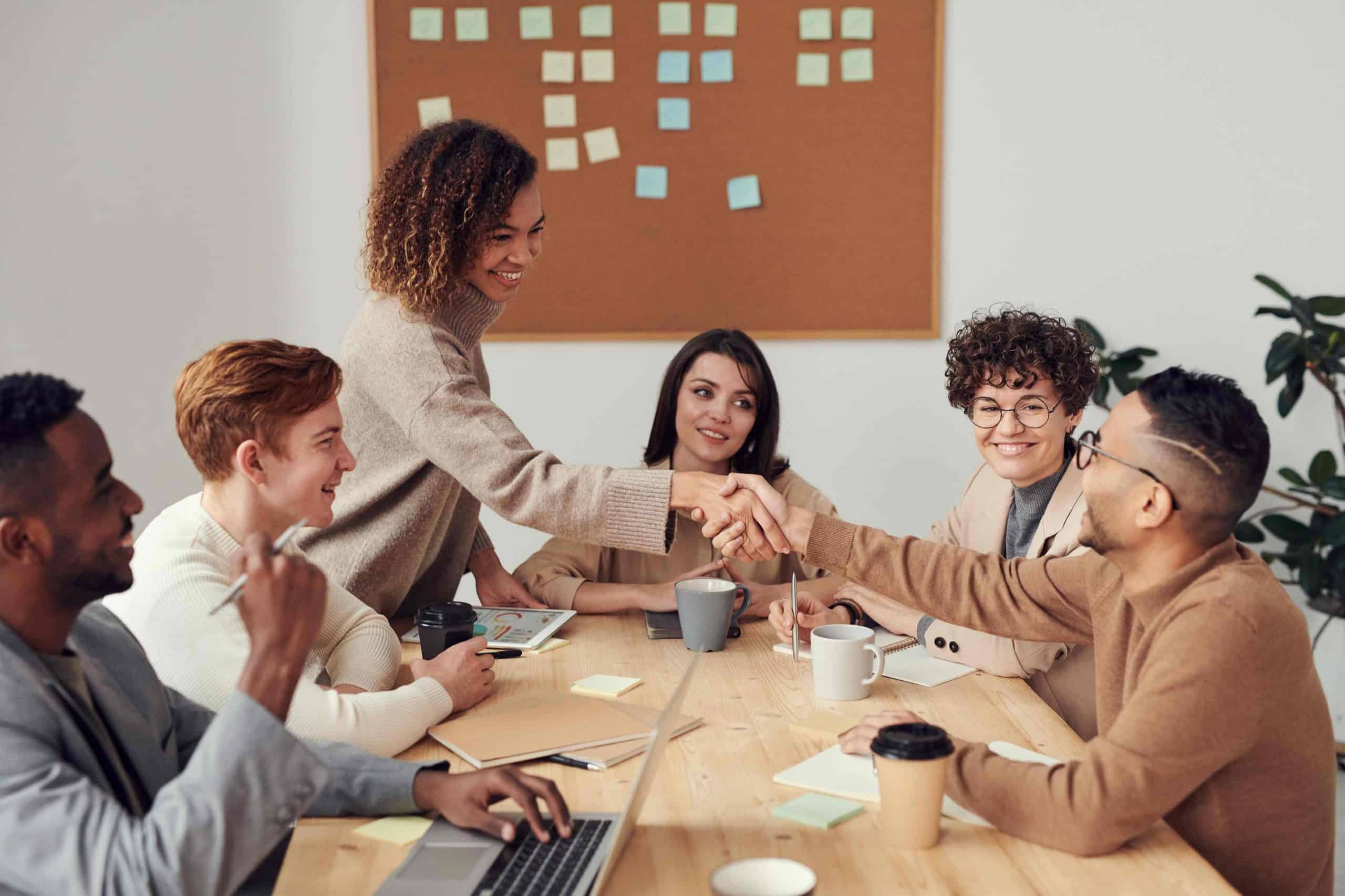 people sitting around a table working together