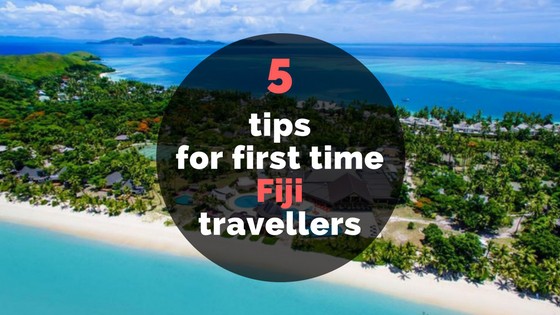 text '5 tips for first time Fiji travellers' over an island of Fiji surrounded by the ocean