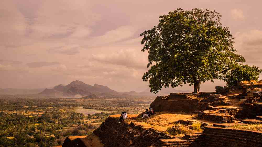 people overlooking a town in Sri Lanka 