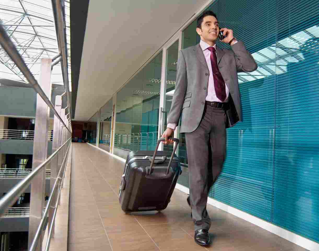 man talking on his phone as he walks