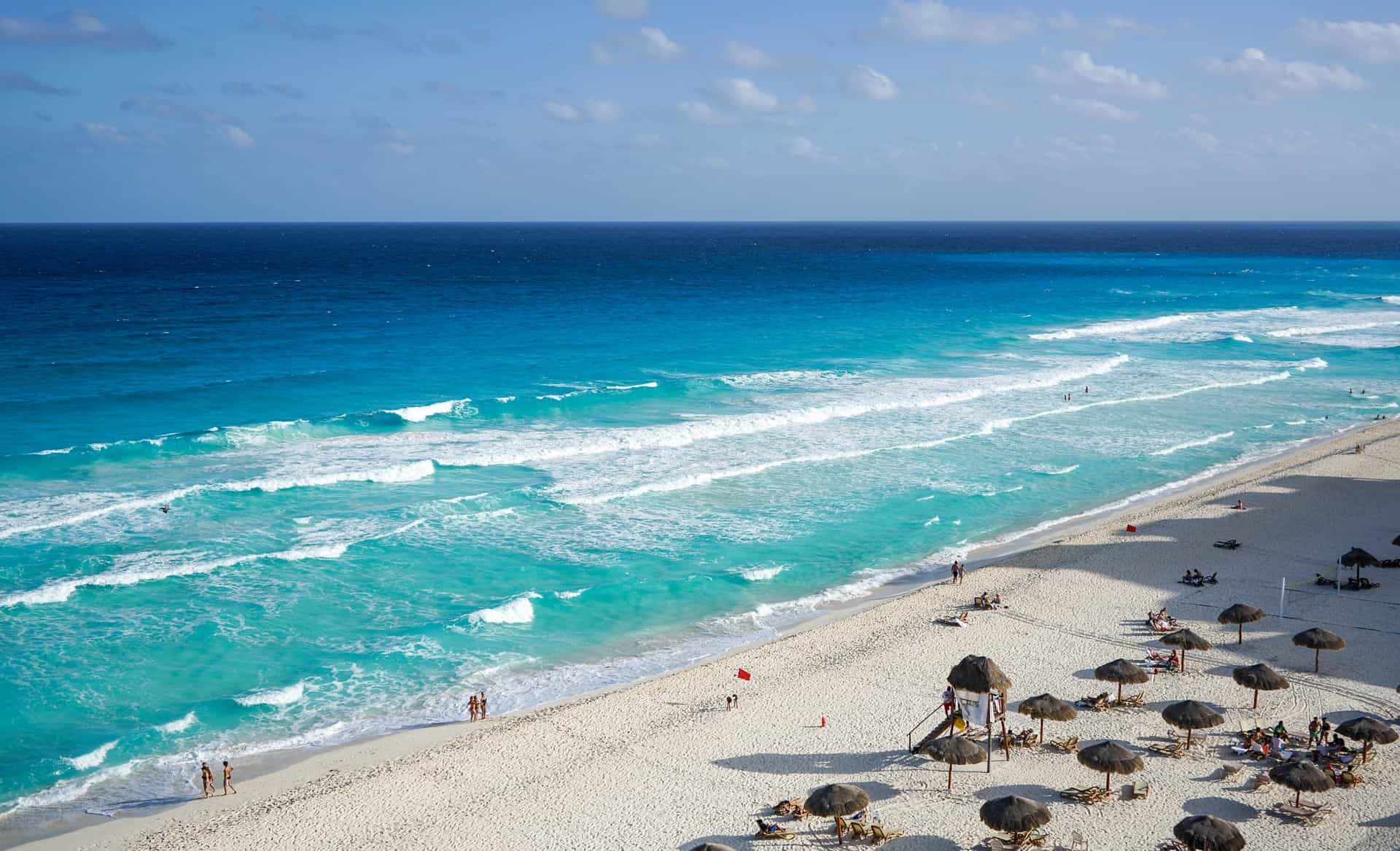 aerial view of the sparkling sea as it meets the shore