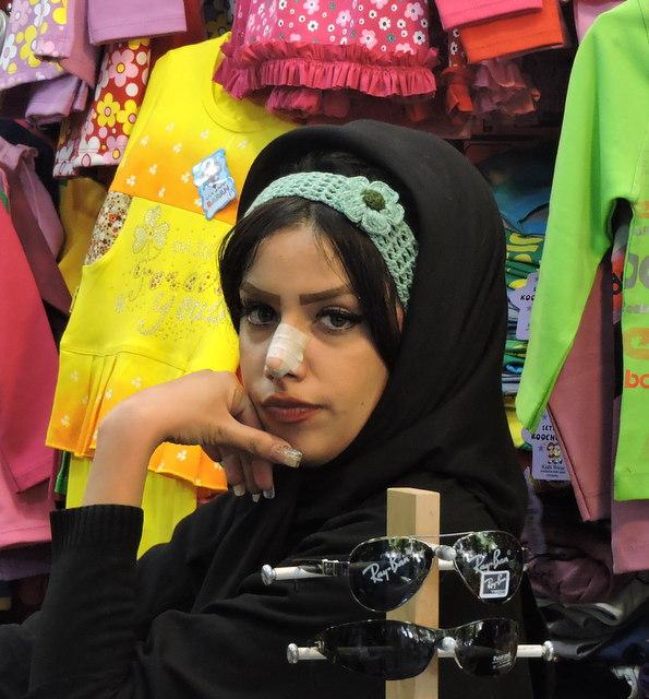 A woman in a market flaunting her 'nose job'