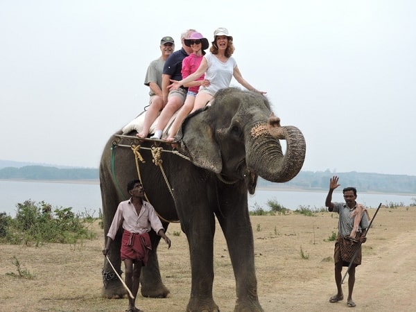 Riding an elephant in India