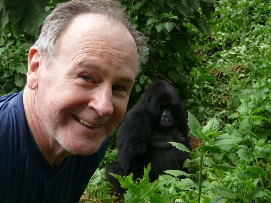 Man beside a baby gorilla