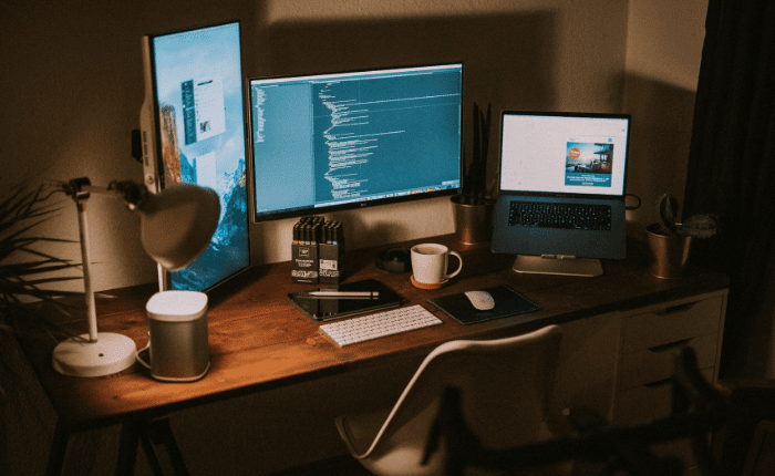 desk with multiple screens open