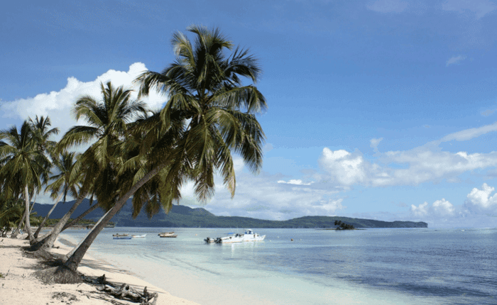 boats by the shore on an island