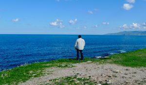 A man standing on the beach