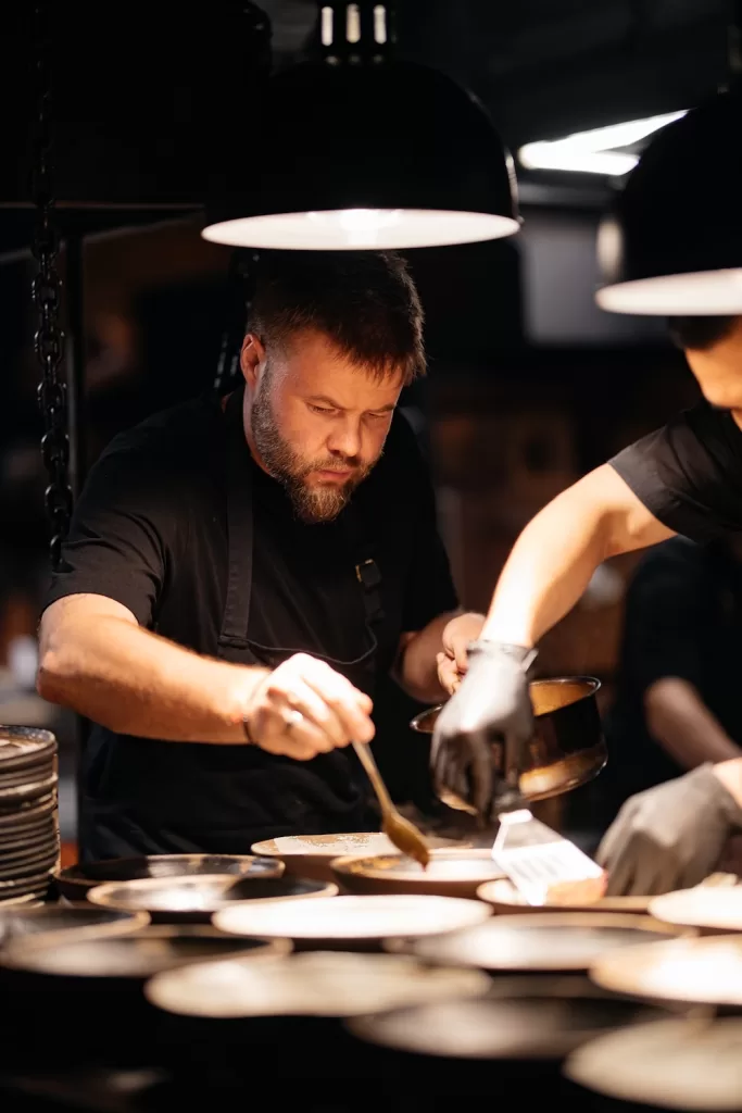 Auyl's head chef, Ruslan Zakirov, presiding over the open kitchen.