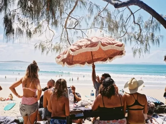 Every day life unfolds on Australia’s golden sands. Photo courtesy of Raygar He_Unsplash.