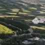 Rolling emerald fields and soft skies in County Kerry.