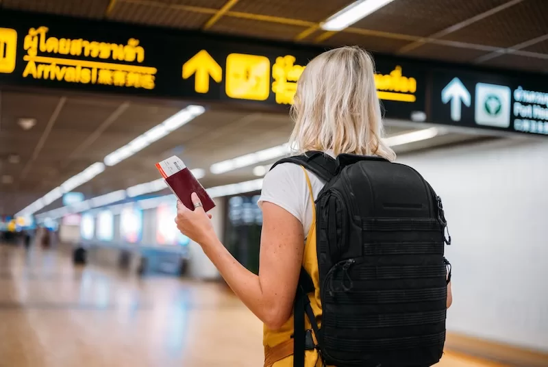 Passport with tourist visa stamp on airport counter