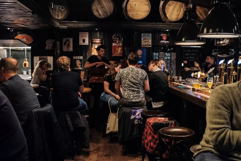 A warm welcome: locals gather over pints.