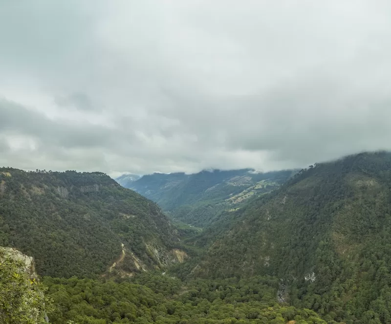 The morning fog hovers over the mountains outside Zacatlán de las Manzanas.