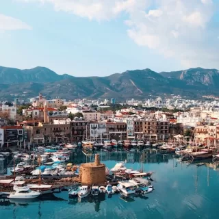 The historic harbor blends Ottoman architecture with modern Mediterranean charm.