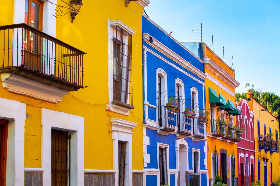 A street with a row of homes in Puebla, Mexico