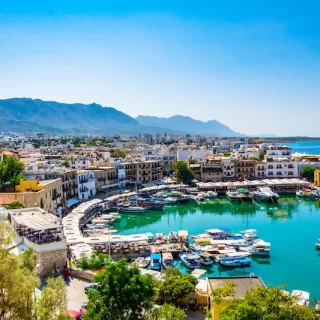 The historic harbor blends Ottoman architecture with modern Mediterranean charm.