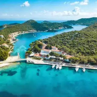 Croatias Tourism: Aerial view of Croatia’s stunning Adriatic coastline, where historic towns meet turquoise waters