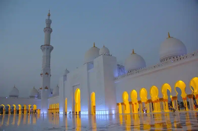 Intricate mosque architecture under the desert sun in the United Arab Emirates. 