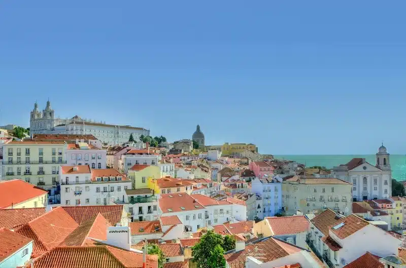 A coastal nation where tradition and modern life share the same streets. 