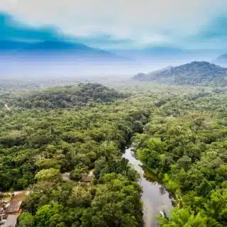 Costa Rica Rainy Season - Rain clouds gather over a quiet Costa Rican road as the season begins