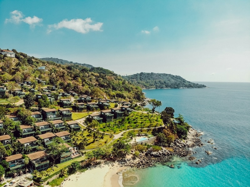 Beachfront hillside villas overlooking turquoise waters, island living at its most sought-after during Thailand’s peak rental season.