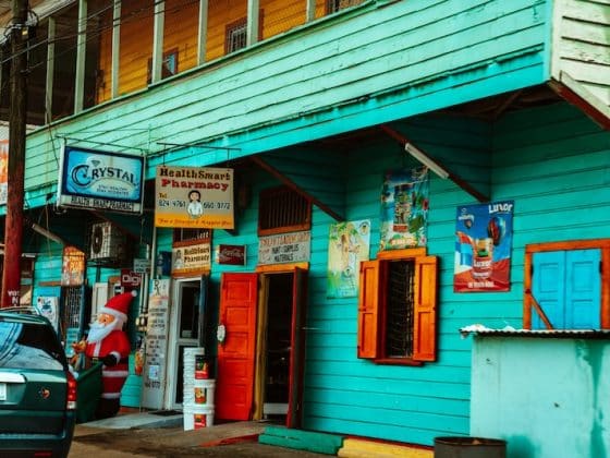 English is everywhere, from shop signs to daily greetings on Belize’s colorful streets.