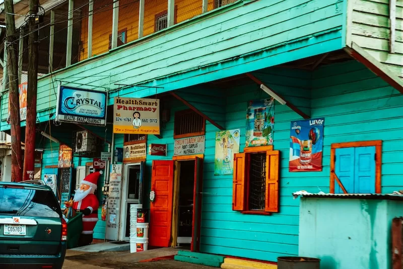 English is everywhere, from shop signs to daily greetings on Belize’s colorful streets.
