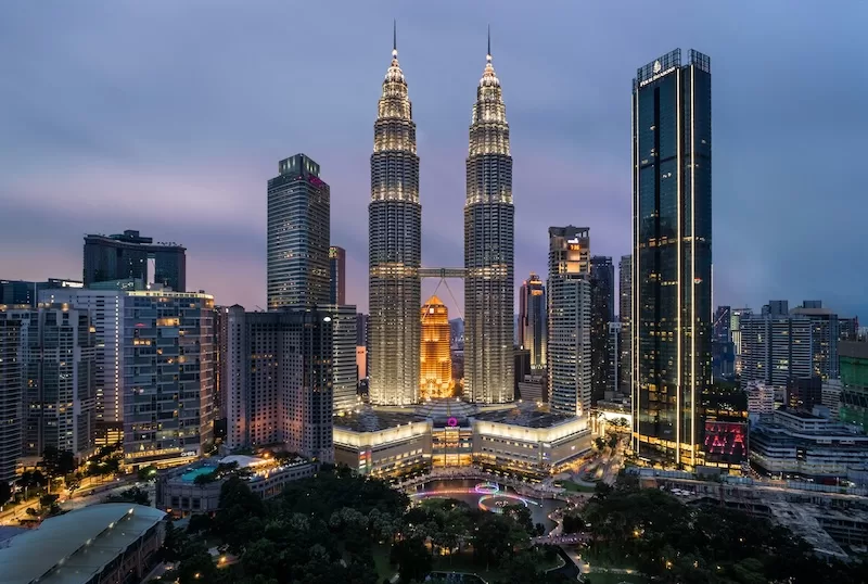 The Petronas Towers lighting up Kuala Lumpur’s skyline — a beacon for those ready to start their second sunrise in Malaysia.