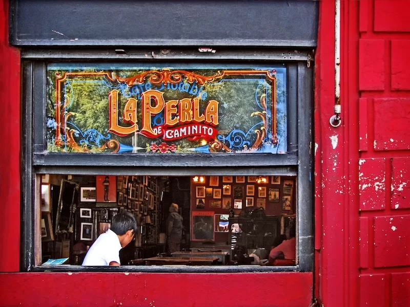 Red walls, old letters, and the bustle of conversation — Buenos Aires captures beauty in the ordinary.