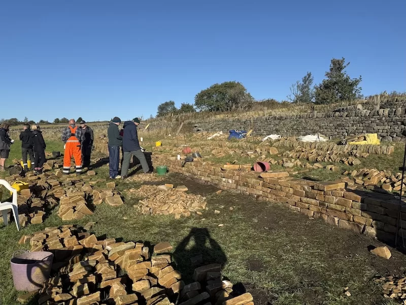 Mike Cobb still makes time to learn building walls by hand
