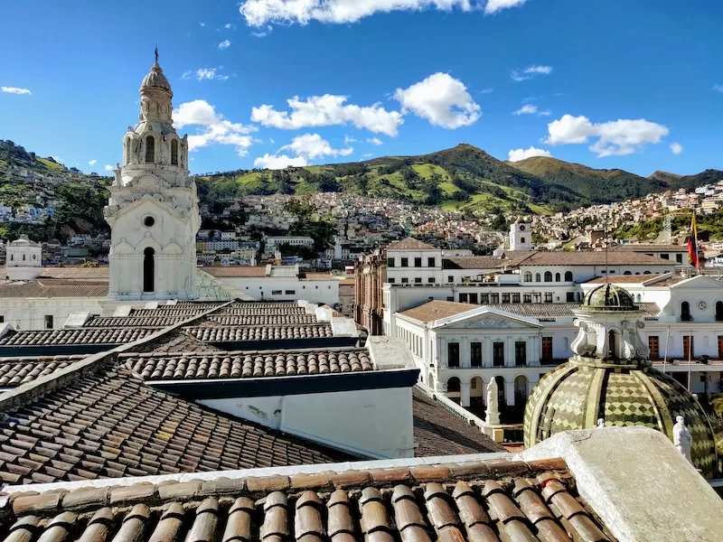 Quito’s historic center unfolds beneath the Andes, where domed churches and whitewashed towers meet mountain light. A UNESCO World Heritage gem suspended between past and sky.
