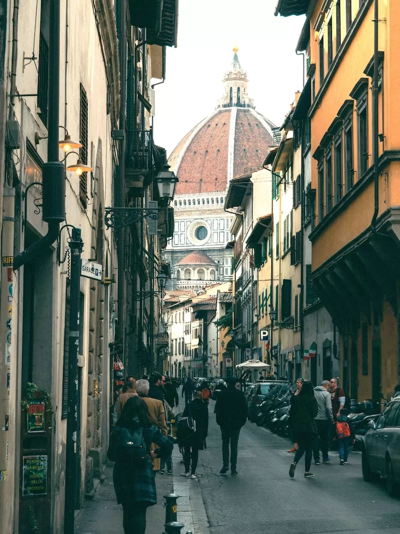 Florence turns daily errands into art history. Apartments near the Duomo carry a price for proximity, but just across the Arno, rents drop and life slows to a walk, proof that in Italy, beauty doesn’t always have to cost extra.