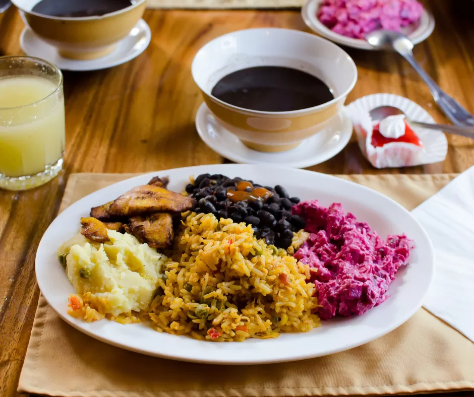 A classic Costa Rican Casado (rice, beans, plantains, salad, and a protein) served at a local soda. Fresh, filling, and affordable, it’s the country’s everyday comfort meal.