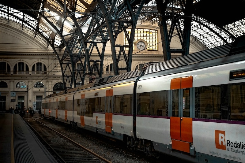 A Rodalies commuter train at Barcelona’s Estació de França. In Spain, efficient public transport keeps daily life affordable and connected, with passes costing a fraction of U.S. equivalents.