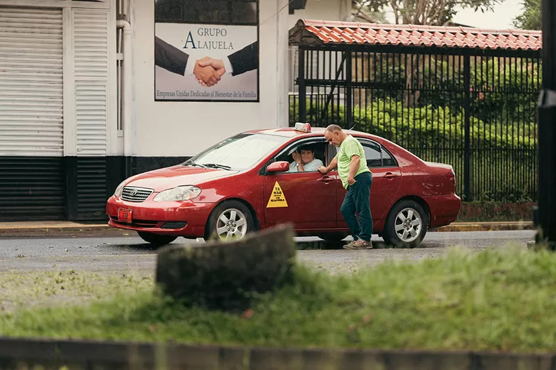 Official red taxis like this one are a common sight across Costa Rica’s cities. Affordable, reliable, and regulated by meters, they’re the go-to choice for quick urban travel.